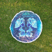 Round Beach Towel with Starsign print in dark blue and bright shiny blue and the stars in the background. Masmarizing Design of your starsign Gemini on grass setup.